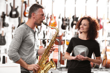 Man and woman in music shop