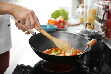 Mixing vegetables in pan closeup