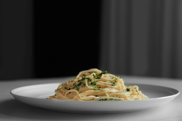 Tasty spaghetti on white plate in restaurant