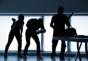 Armed thieves entering a house