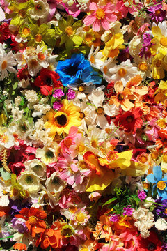 Colorful artificial flowers - floral background