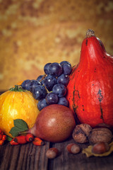 Autumn fruit and vegetable on wooden table 