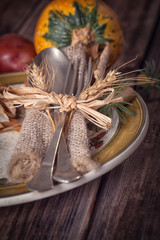 Autumn place setting - on wooden table