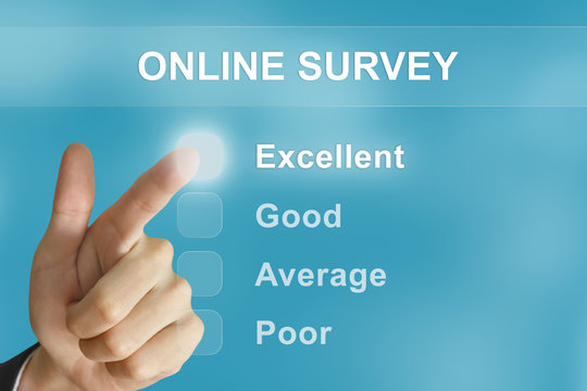 business hand pushing online survey button