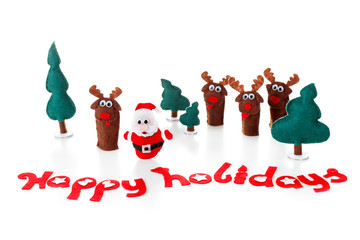 Concept, Christmas toys. Santa with reindeer and fir tree on snow