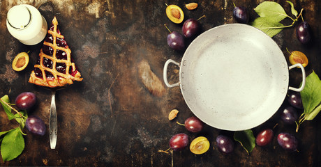 Plum tart and fresh plums