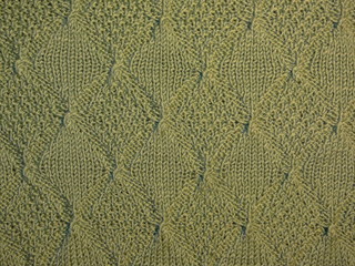зеленая вязаная ткань, текстура вязаной зеленой ткани