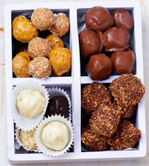 all sorts of handmade bonbons  in a box.