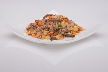 salad in a white plate on a white background