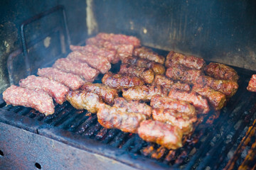 Meat frying on grill