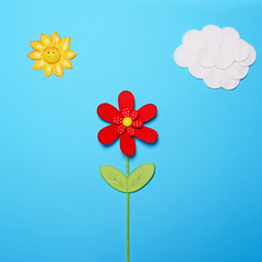 Fairy tail scene made of various objects on blue paper 