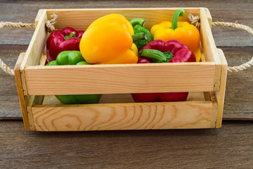  colorful of fresh  sweet bell pepper on wooden basket