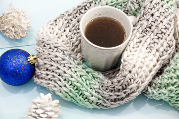 Cosy soft winter background, knitted sweater Cup hot coffee old vintage wooden board. Christmas holidays at home. place for text, Top view, flat lay with copy space  slogan or  message