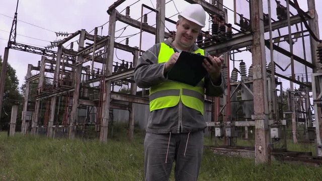 Happy electrician showing o.k sign
