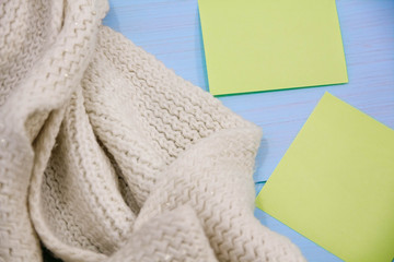 Cosy soft winter background, knitted sweater Cup hot coffee old vintage wooden board. Christmas holidays at home. place for text, Top view, flat lay with copy space  slogan or  message