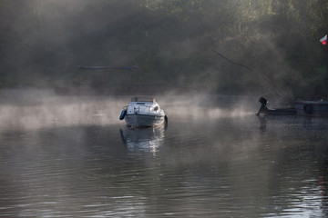 Naklejka premium spiritual landscape on the misty river 