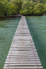 Wooden bridge on sea for tourist walking and relaxing.