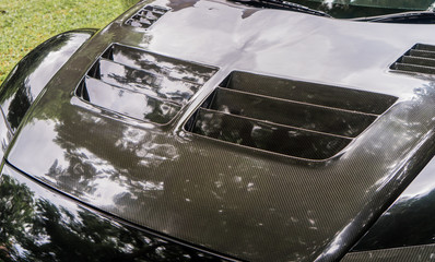 Black Carbon fiber of a racing Car front engine cover
