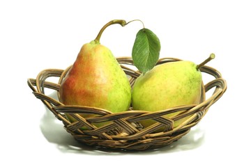 Two ripe yellow pears in basket