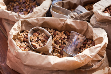 Salted peanuts in a paper bag closeup. Street food.