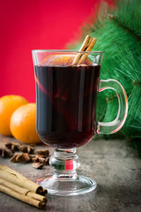 Christmas mulled wine and Christmas decoration on wooden table

