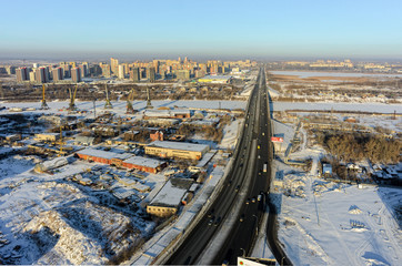 Tyumen, Russia - December 2, 2015: Aerial view on Tyumen river port, vehicle bridge and European residential district