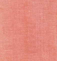 Red textile book cover surface.