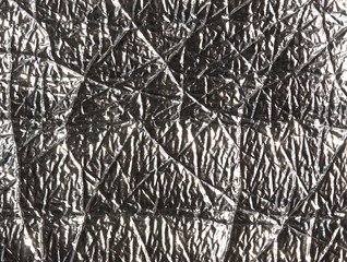 Grey metal foil surface.