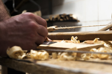 carpenter working,hammer,meter and screw-driver on construction