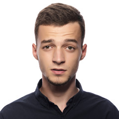 Obraz premium Young handsome man in a dark shirt.