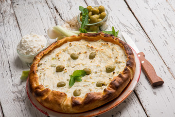 salted cake with ricotta green olives and mint