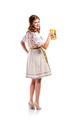 Woman in traditional bavarian dress holding beer