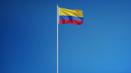 Colombia flag waving against clean blue sky, long shot, isolated with clipping path mask alpha channel transparency