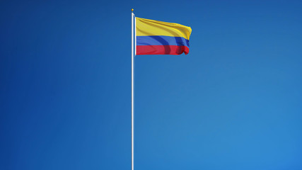Colombia flag waving against clean blue sky, long shot, isolated with clipping path mask alpha channel transparency