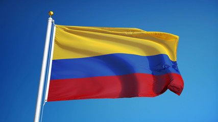 Fototapeta na wymiar Colombia flag waving against clean blue sky, close up, isolated with clipping path mask alpha channel transparency