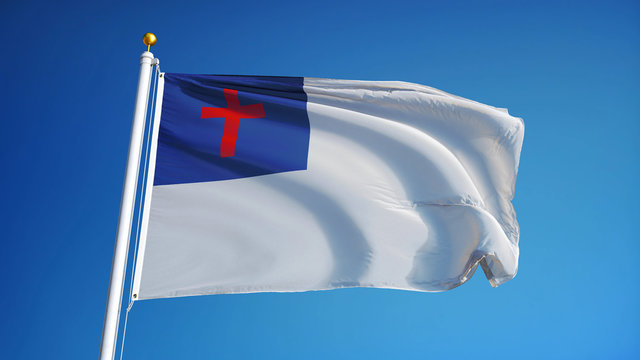 Christian flag waving against clean blue sky, close up, isolated with clipping path mask alpha channel transparency