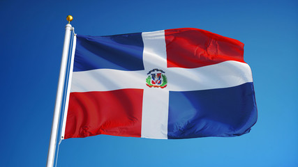Dominican Republic flag waving against clean blue sky, close up, isolated with clipping path mask...