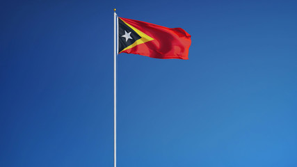 East Timor waving against clean blue sky, long shot, isolated with clipping path mask alpha channel transparency
