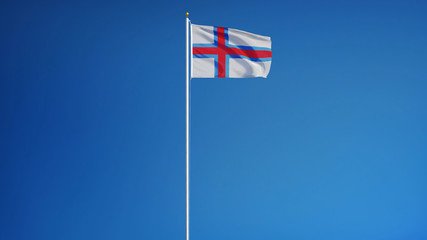 Faroe Islands flag waving against clean blue sky, long shot isolated with clipping path mask alpha channel transparency digital composition