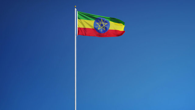 Ethiopian flag waving against clean blue sky, long shot, isolated with clipping path mask alpha channel transparency