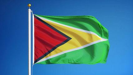 Guyana flag waving against clean blue sky, close up, isolated with clipping path mask alpha channel transparency