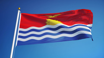 Kiribati flag waving against clean blue sky, close up, isolated with clipping path mask alpha channel transparency