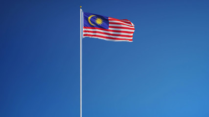 Malaysia flag waving against clean blue sky, long shot, isolated with clipping path mask alpha channel transparency