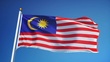 Malaysia flag waving against clean blue sky, close up, isolated with clipping path mask alpha...