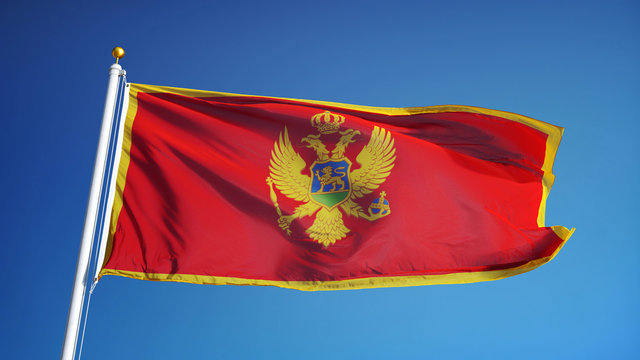 Montenegro flag waving against clean blue sky, close up, isolated with clipping path mask alpha channel transparency
