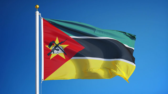 Mozambique flag waving against clean blue sky, close up, isolated with clipping path mask alpha channel transparency