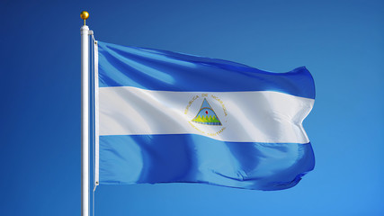 Nicaragua flag waving against clean blue sky, close up, isolated with clipping path mask alpha channel transparency