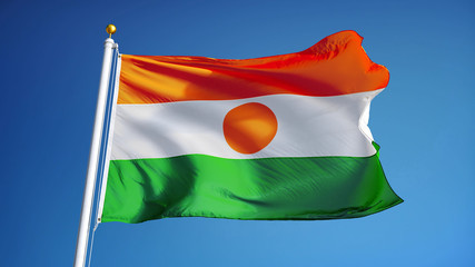 Niger flag waving against clean blue sky, close up, isolated with clipping path mask alpha channel...