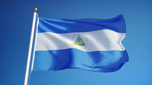 Nicaragua flag waving against clean blue sky, close up, isolated with clipping path mask alpha channel transparency - Powered by Adobe