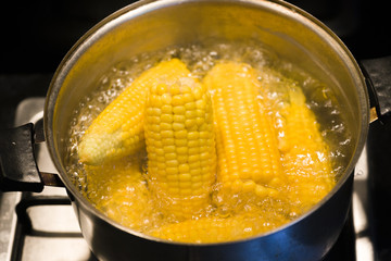 Boiled corn in a pot.